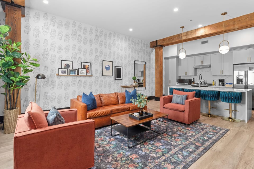 Relax in the living area with a smart TV, stylish seating, and a sleeper sofa for extra guests. Perfect for families or group stays in New Orleans, this inviting space is ideal for movie nights or recharging after a day in the city.