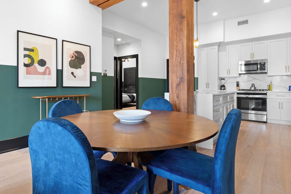 Enjoy meals together at your in-suite dining table with seating for your group. Whether it's takeout, delivery, or a home-cooked meal, this cozy dining area makes every stay at 888 Baronne feel like home in New Orleans.
