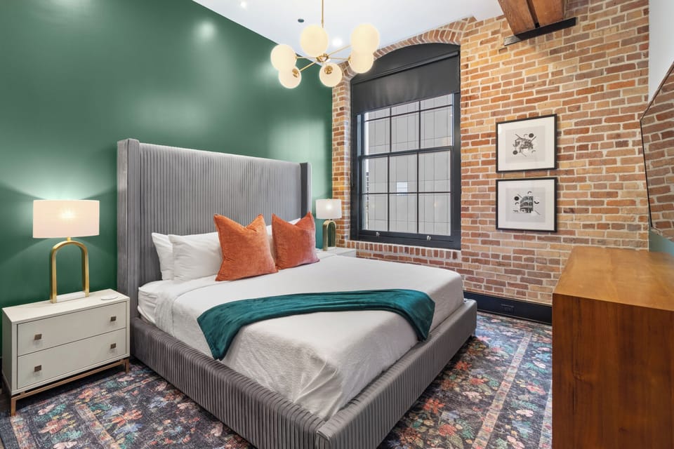 Retreat to the primary bedroom with a plush king bed, walk-in closet, blackout shades, and a smart TV. Designed for comfort and privacy, this suite is perfect for recharging after a day exploring New Orleans.