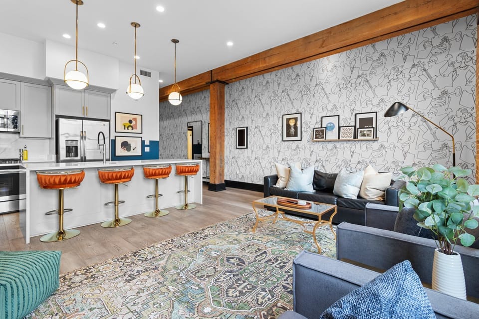 Relax in the living area with a smart TV, stylish seating, and a sleeper sofa for extra guests. Perfect for families or group stays in New Orleans, this inviting space is ideal for movie nights or recharging after a day in the city.