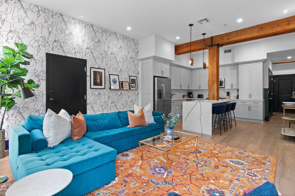 Relax in the living area with a smart TV, stylish seating, and a sleeper sofa for extra guests. Perfect for families or group stays in New Orleans, this inviting space is ideal for movie nights or recharging after a day in the city.