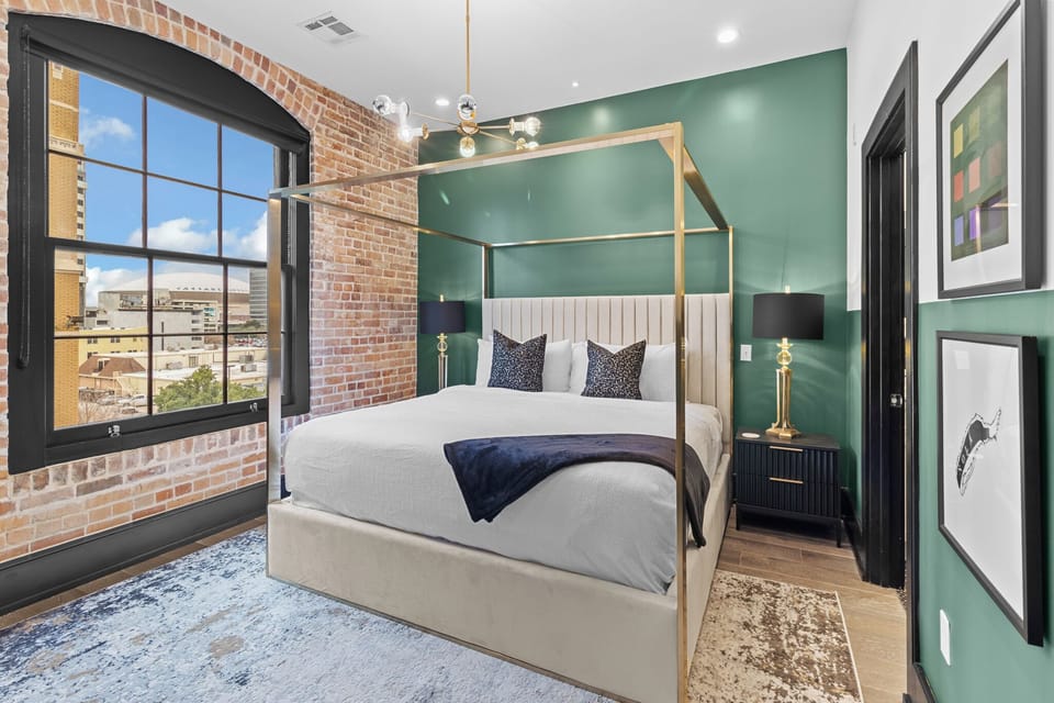 Retreat to the Primary bedroom with a plush king bed, walk-in closet, blackout shades, and a smart TV. Designed for comfort and privacy, this suite is perfect for recharging after a day exploring New Orleans.