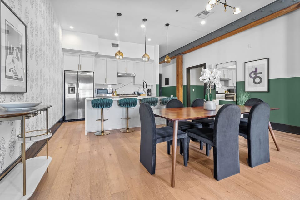 Enjoy meals together at your in-suite dining table with seating for your group. Whether it's takeout, delivery, or a home-cooked meal, this cozy dining area makes every stay at 888 Baronne feel like home in New Orleans.