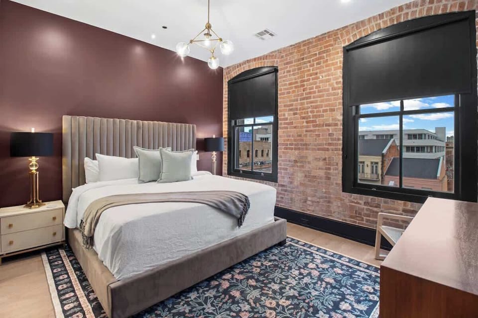 Retreat to the Primary bedroom with a plush king bed, walk-in closet, blackout shades, and a smart TV. Designed for comfort and privacy, this suite is perfect for recharging after a day exploring New Orleans.