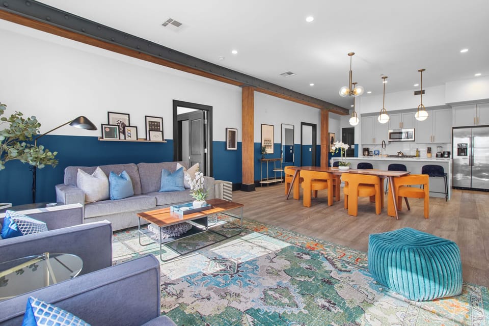 Relax in the living area with a smart TV, stylish seating, and a sleeper sofa for extra guests. Perfect for families or group stays in New Orleans, this inviting space is ideal for movie nights or recharging after a day in the city.