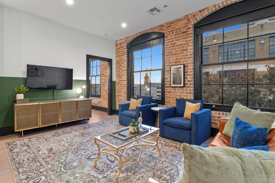 Relax in the living area with a smart TV, stylish seating, and a sleeper sofa for extra guests. Perfect for families or group stays in New Orleans, this inviting space is ideal for movie nights or recharging after a day in the city.
