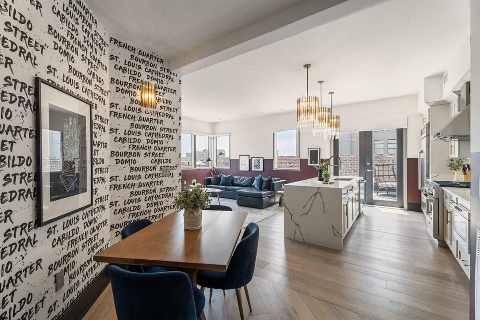 Enjoy meals together at your in-suite dining table with seating for your group. Whether it's takeout, delivery, or a home-cooked meal, this cozy dining area makes every stay at 888 Baronne feel like home in New Orleans.
