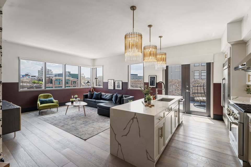 Relax in the living area with a smart TV, stylish seating, and a sleeper sofa for extra guests. Perfect for families or group stays in New Orleans, this inviting space is ideal for movie nights or recharging after a day in the city.