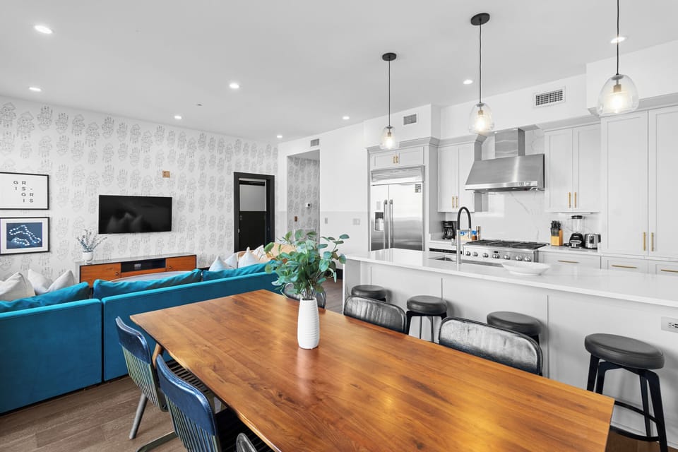 Enjoy meals together at your in-suite dining table with seating for your group. Whether it's takeout, delivery, or a home-cooked meal, this cozy dining area makes every stay at 888 Baronne feel like home in New Orleans.
