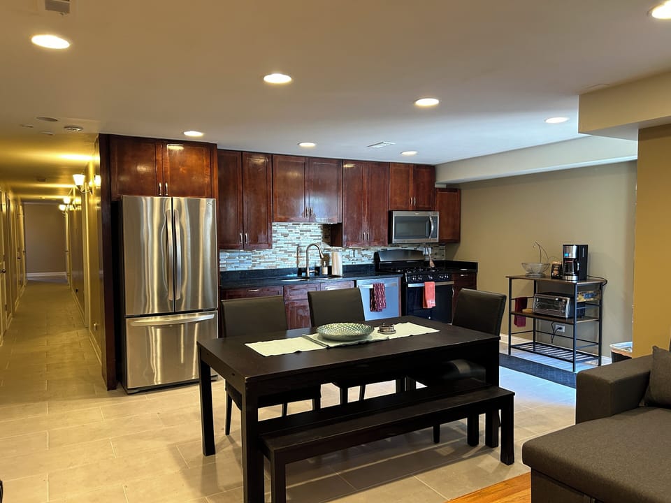 The open-concept kitchen and living room. Expandable dining table.