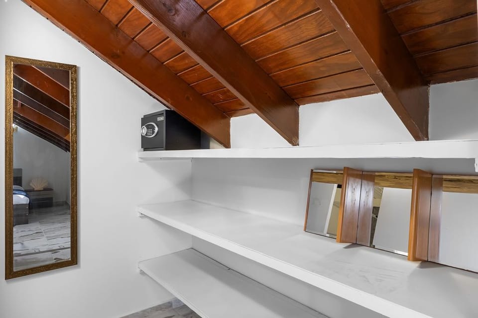 A full-size body mirror and a safety box are included in the space designated for your belongings.