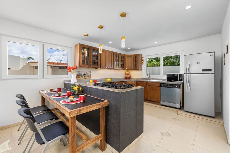Fully equipped kitchen with extra tables and chairs.