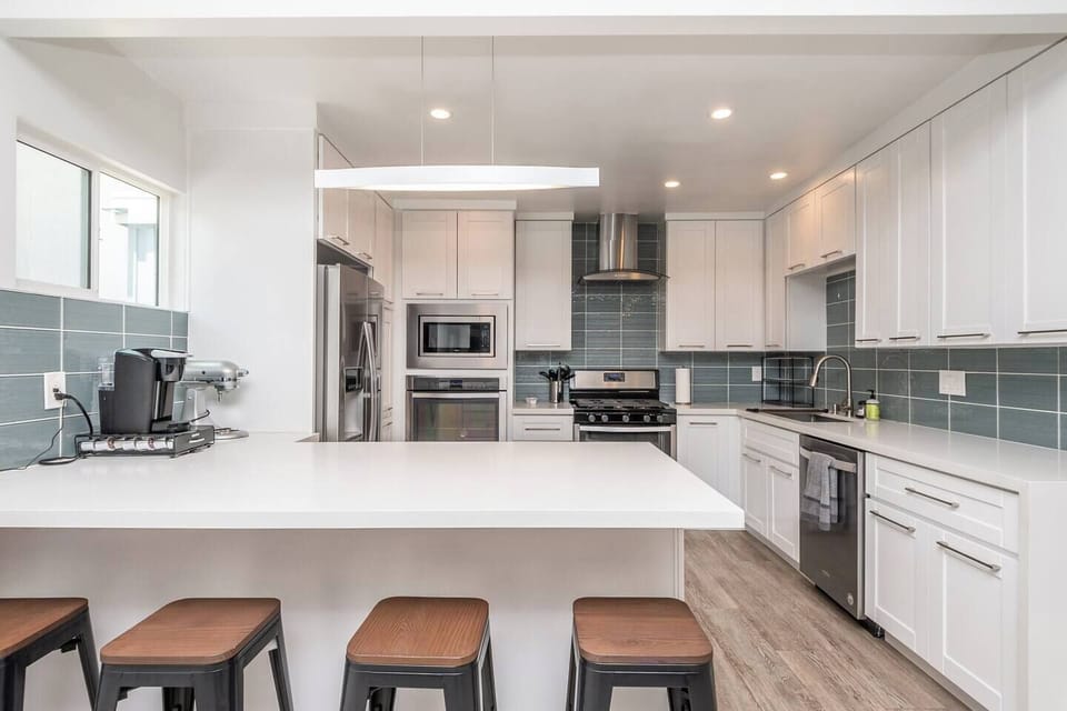 Fully stocked kitchen, including dishes, cooking supplies, spices, Keurig