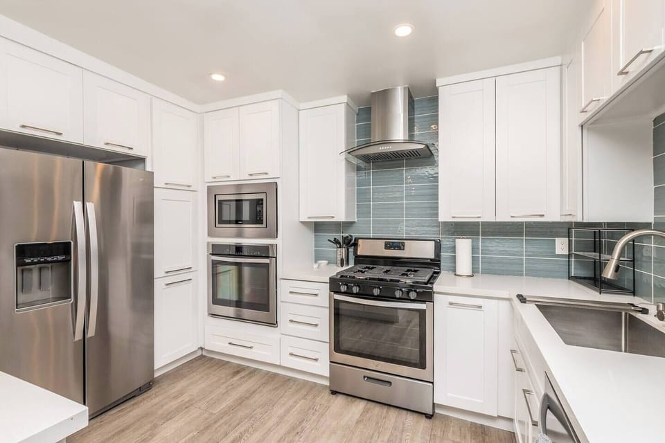 Fully stocked kitchen, including dishes, cooking supplies, spices, Keurig