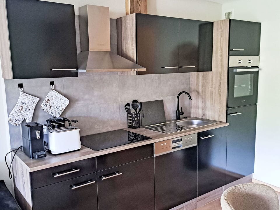 Cabinetry, Property, Furniture, Countertop, Tap, Kitchen Stove, Kitchen, Interior Design, Sink, Kitchen Appliance