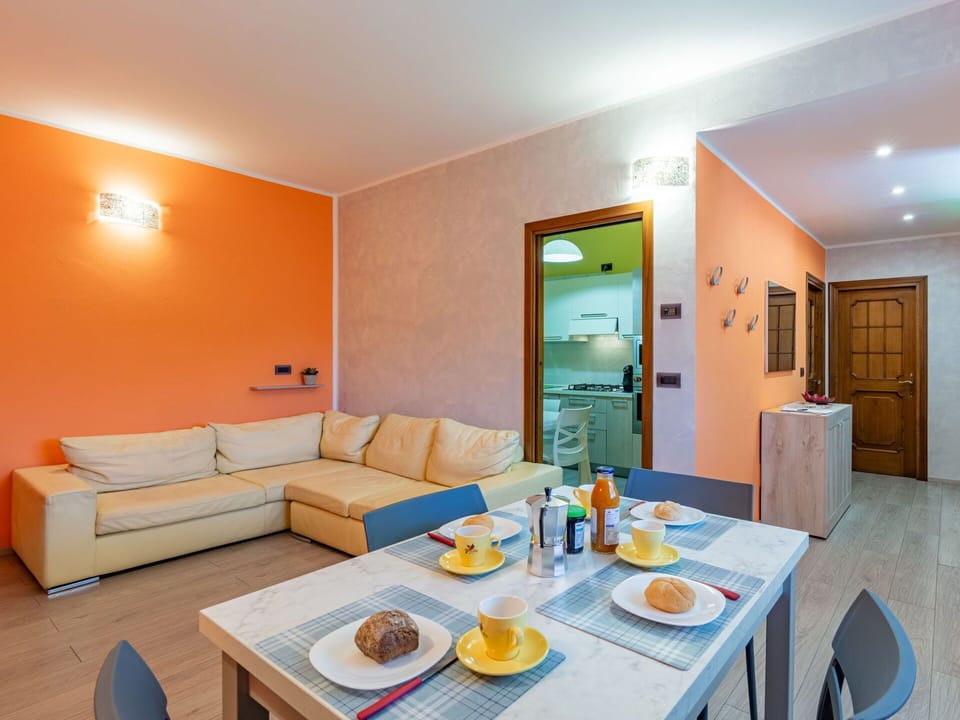 Table, Furniture, Property, Tableware, Couch, Azure, Orange, Wood, Cabinetry, Interior Design