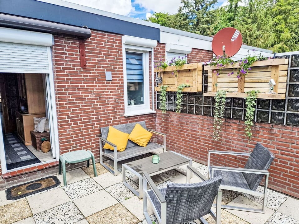 Furniture, Building, Window, Brick, Outdoor Furniture, Road Surface, Brickwork, Plant, Wood, Chair