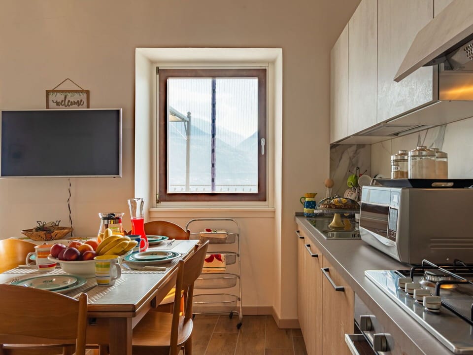Furniture, Window, Cabinetry, Countertop, Table, Wood, Lighting, Kitchen, Building, Floor