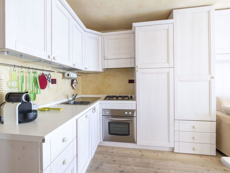 Kitchen, Kitchen Appliance, Cabinetry, Countertop, Major Appliance, Furniture, Wood, Interior Design, Flooring, Cupboard