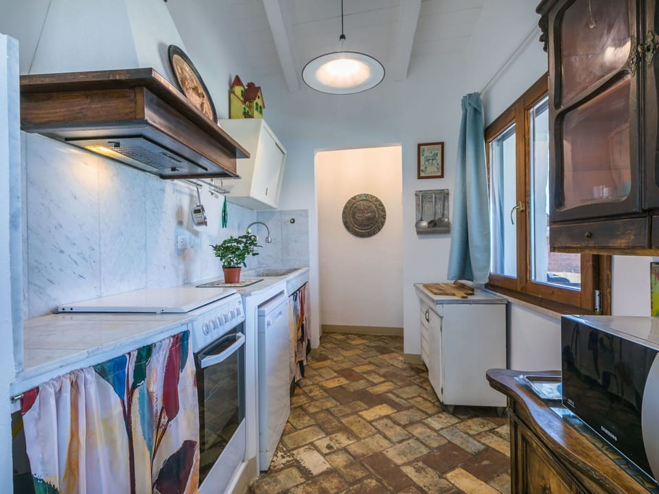 Cabinetry, Property, Azure, Countertop, Picture Frame, Wood, Interior Design, Kitchen, Architecture, Houseplant