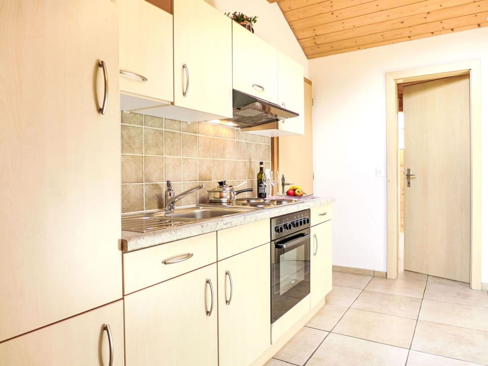 Cabinetry, Countertop, Kitchen Sink, Sink, Tap, Kitchen Stove, Kitchen Appliance, Building, Door, Wood