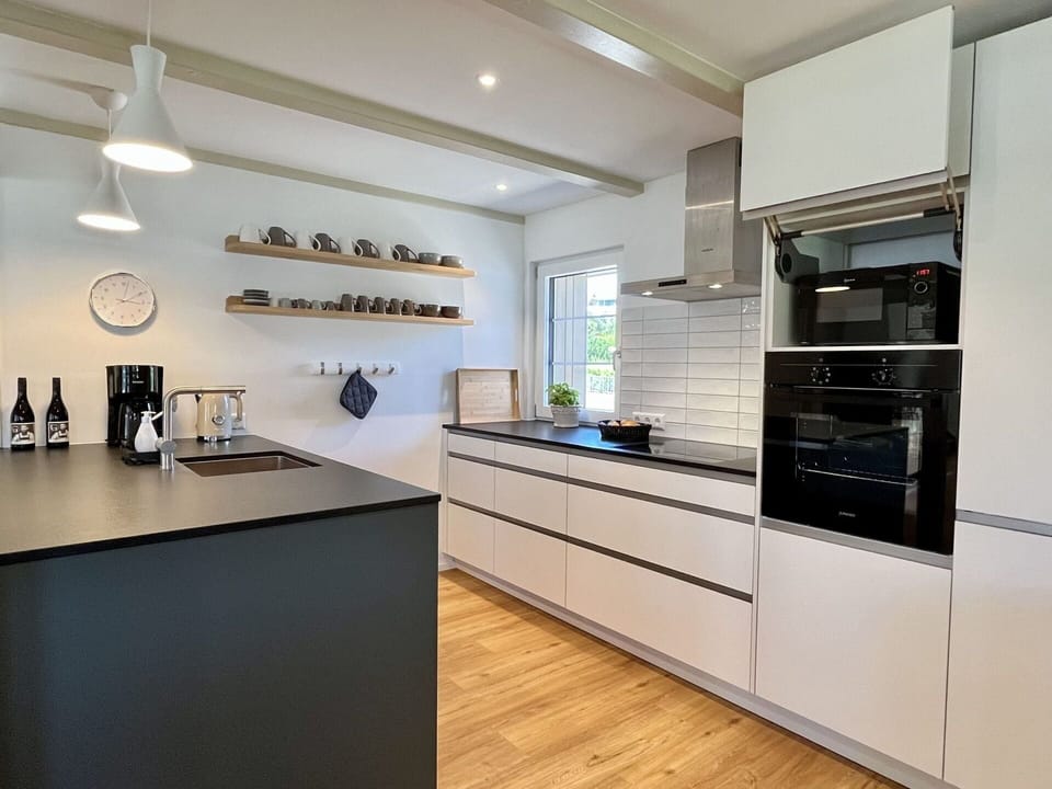 Cabinetry, Countertop, Property, Kitchen Appliance, Home Appliance, Kitchen, Lighting, Interior Design, Wood, Flooring
