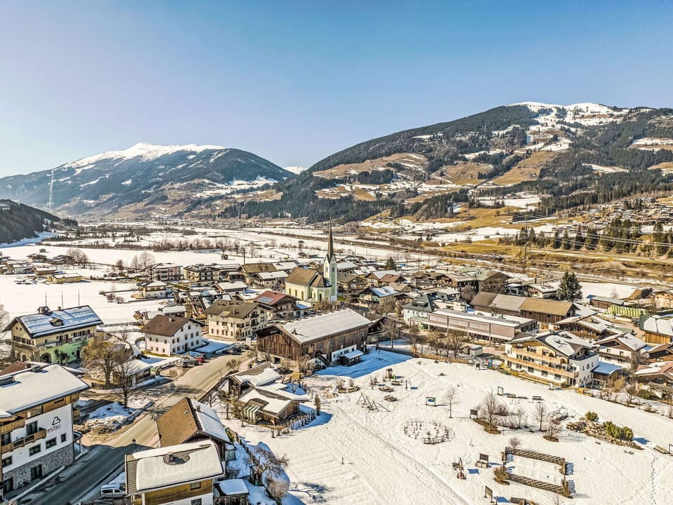Sky, Mountain, Snow, Building, Slope, Mountainous Landforms, Residential Area, City, Mountain Range, Landscape