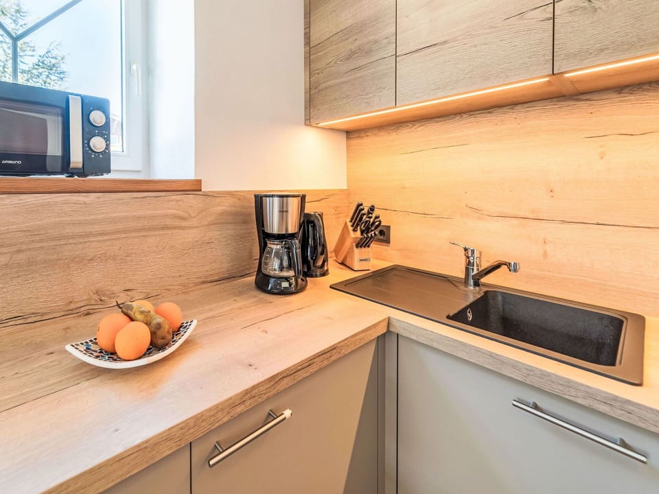 Cabinetry, Countertop, Kitchen Sink, Property, Kitchen, Tap, Wood, Kitchen Appliance, Kitchen Stove, Home Appliance