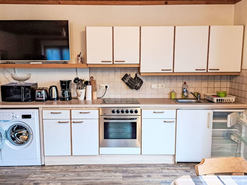 Brown, Cabinetry, Kitchen Sink, Property, Sink, Countertop, Tap, Kitchen Stove, Kitchen, Wood