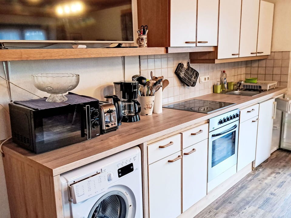 Cabinetry, Countertop, Property, White, Kitchen Appliance, Kitchen, Kitchen Stove, Home Appliance, Wood, Interior Design