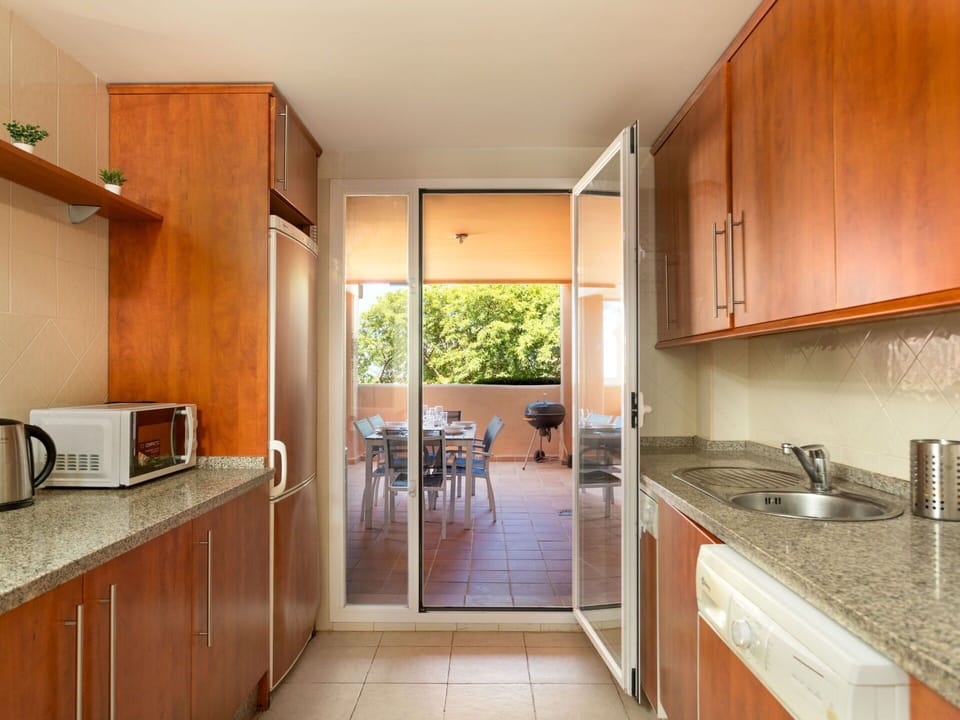 Cabinetry, Countertop, Kitchen Sink, Kitchen Stove, Kitchen Appliance, Kitchen, Wood, Home Appliance, Building, Flooring