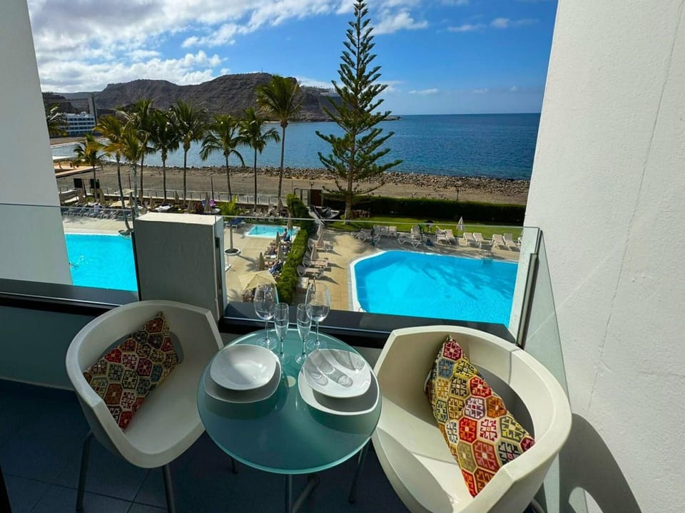 Water, Cloud, Furniture, Property, Sky, Table, Building, Plant, Azure, Houseplant
