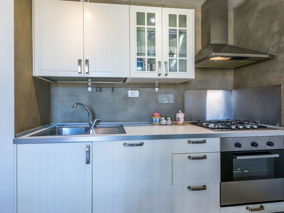 Cabinetry, Tap, Kitchen Sink, Countertop, Property, Sink, Building, Kitchen, Window, Kitchen Stove