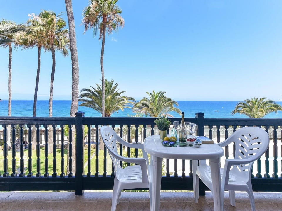 Sky, Water, Property, Plant, Seaside Resort, Azure, Table, Tree, Outdoor Furniture, Arecales