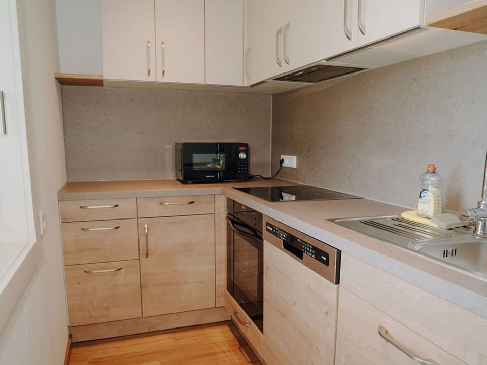 Countertop, Flooring, Kitchen, Kitchen Appliance, Cabinetry, Wood, Furniture, Interior Design, Floor, Major Appliance