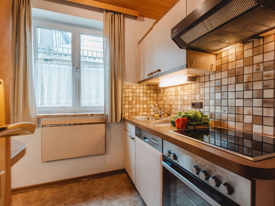 Wall, Kitchen, Countertop, Interior Design, Major Appliance, Kitchen Appliance, Plumbing Fixture, Tap, Plumbing, Cabinetry