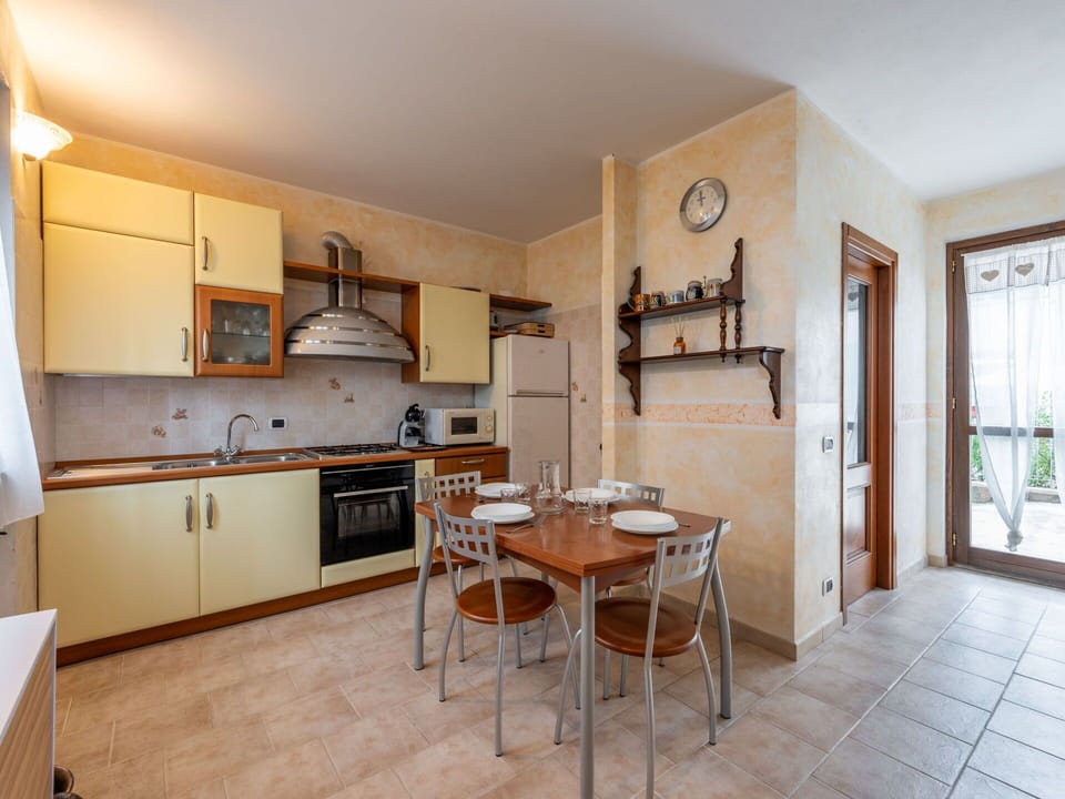 Furniture, Cabinetry, Countertop, Table, Wood, Kitchen, Kitchen Appliance, Door, Kitchen Stove, Flooring