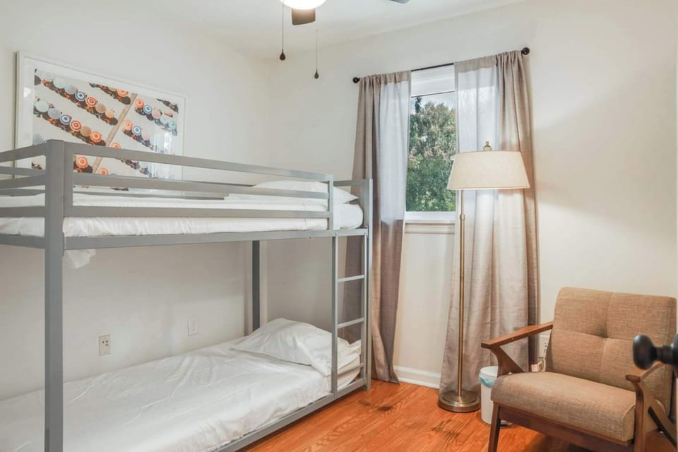 Bedroom 4: One of the bedrooms features a comfortable bunk bed, ideal for families or groups looking for a practical and cozy sleeping arrangement.