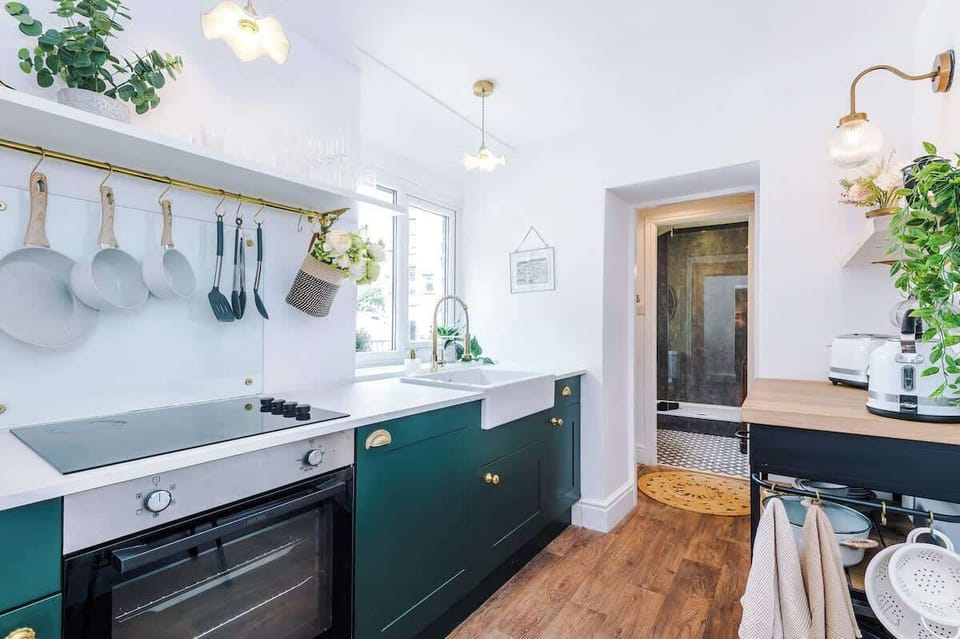 Fully equipped kitchen. Stylish, modern space featuring a farmhouse sink, wooden countertops, and all the essentials for your stay.