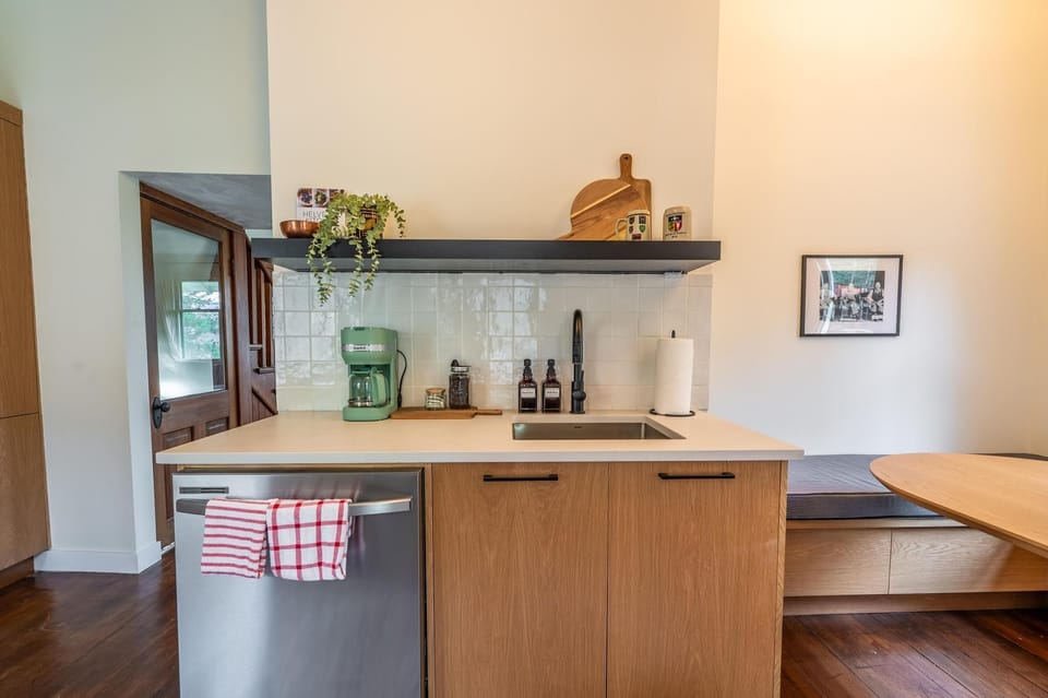 A stylish kitchenette awaits, featuring sleek finishes and modern appliances for your culinary adventures.
