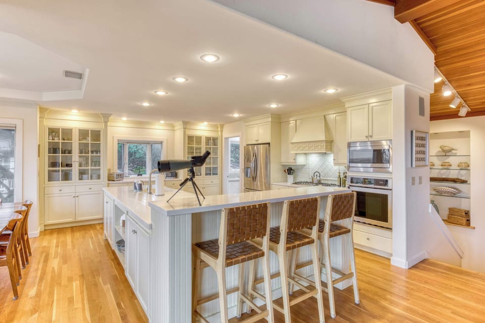 Gather in the open kitchen with everything you need to cook and connect. Downstairs expands the fun with games and more places to sleep.