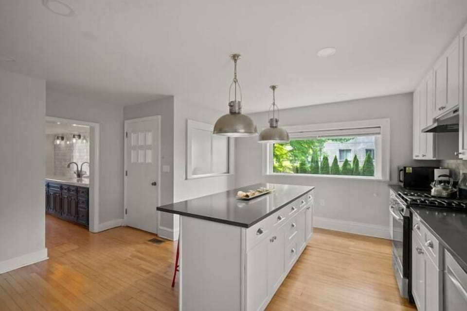 Bright, airy design with stainless steel appliances and a large window 
