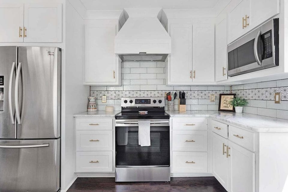 Stainless steel appliances and quartz countertops mean easy cleanup