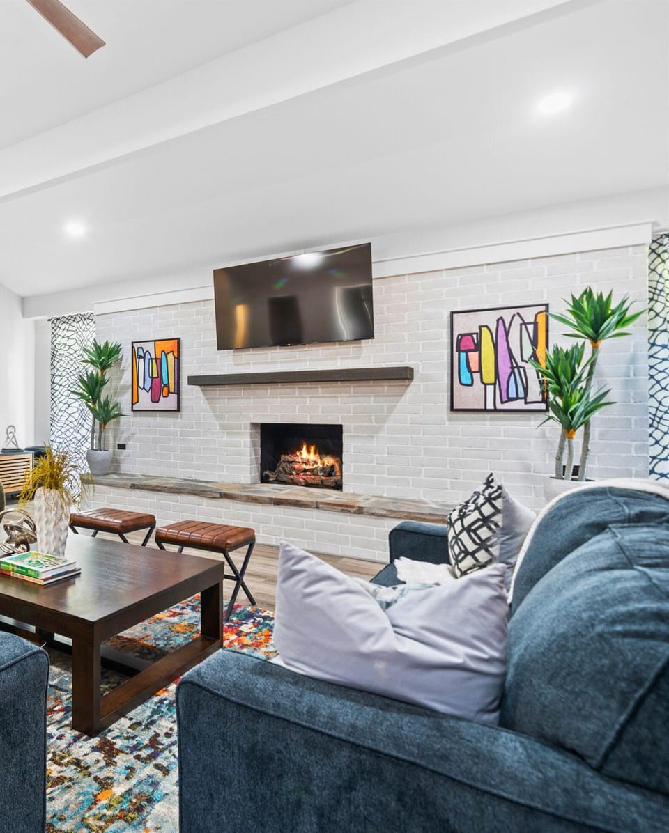 Relax and unwind in the cozy living room, complete with a fireplace and plenty of seating for everyone. It’s the perfect spot for a movie night or warming up after a day on the lake.