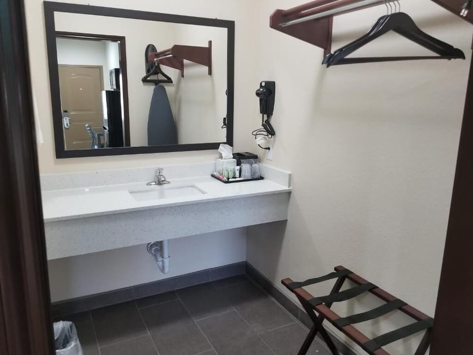 Refresh easily at the bright vanity with convenient toiletries.