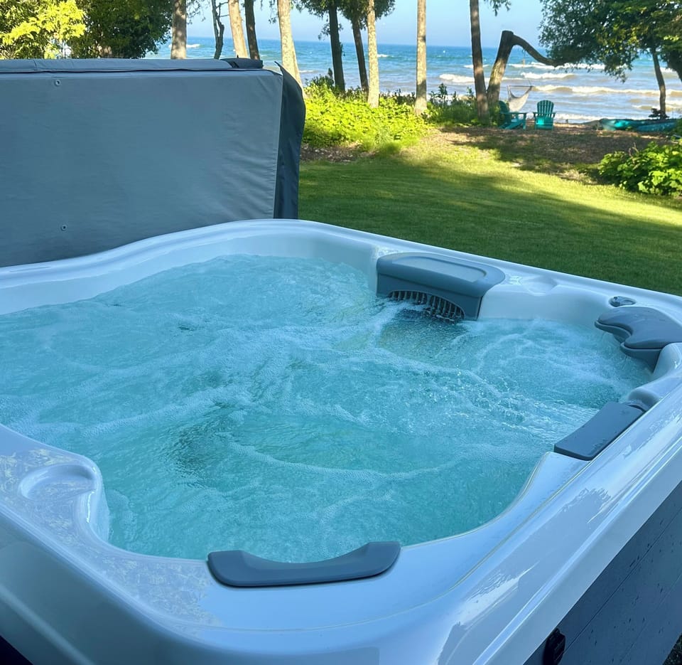 Bull Frog hot tub overlooking the water.