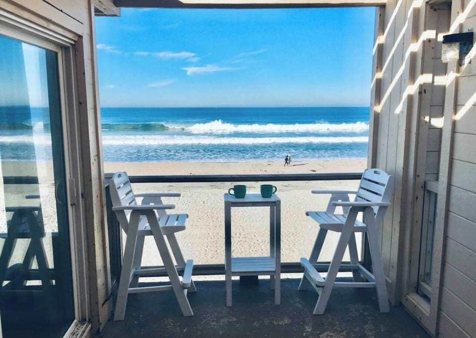 Watch the dolphins and surfers from your balcony!
