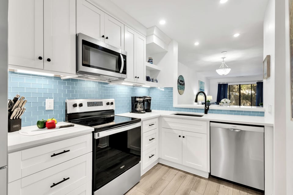 A fully-equipped kitchen has everything necessary to whip up a meal, while the combined living and dining area invites moments of laughter and connection with loved ones.
