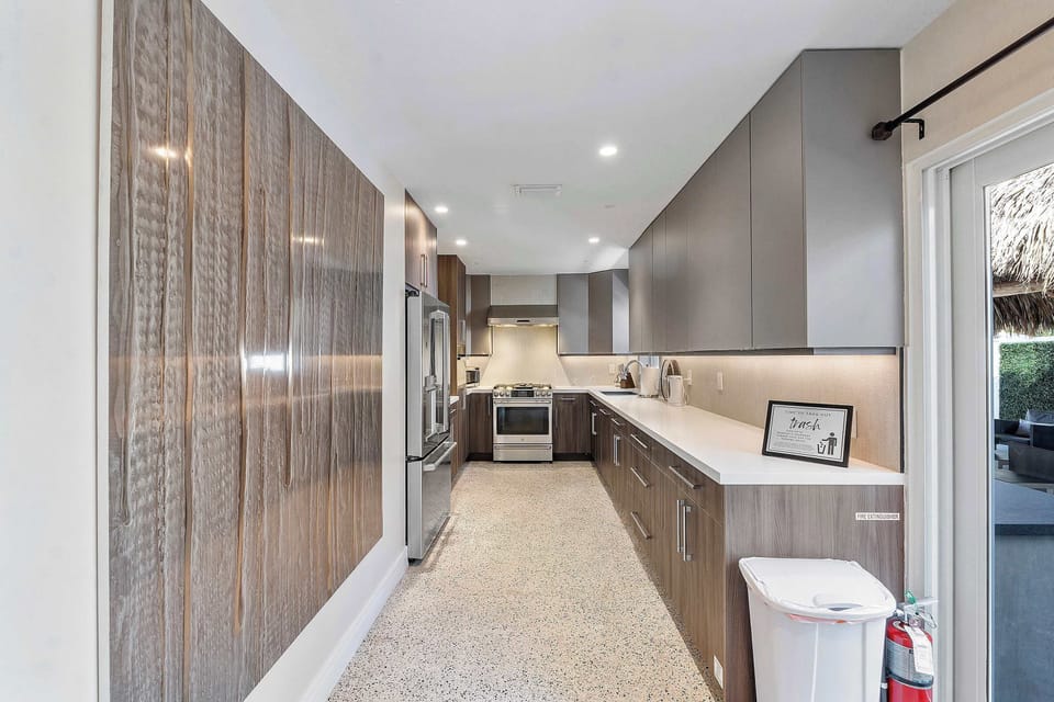 Enjoy the convenience of a spacious kitchen with a large fridge and wide counter space for effortless meal preparation