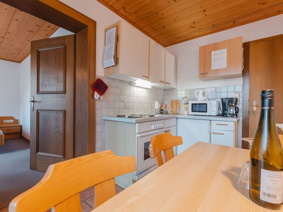 Furniture, Cabinetry, Bottle, Countertop, Wood, Table, Orange, Kitchen, Kitchen Appliance, Interior Design